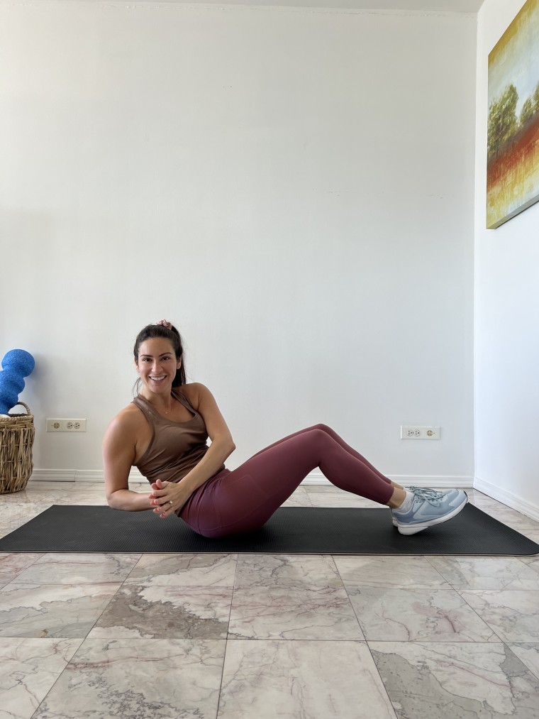 Woman doing the russian twist during tabata