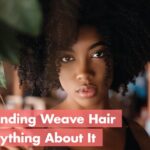 Woman with a sew-in weave, showing added length and volume.