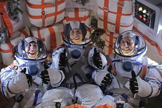 Image of astronauts with &quot;The Big Bang Theory&quot; actors.