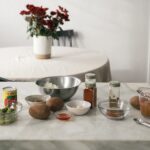 Picadillo ingredients on a wooden table