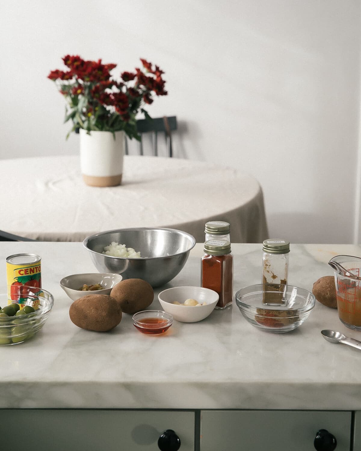 Picadillo ingredients on a wooden table